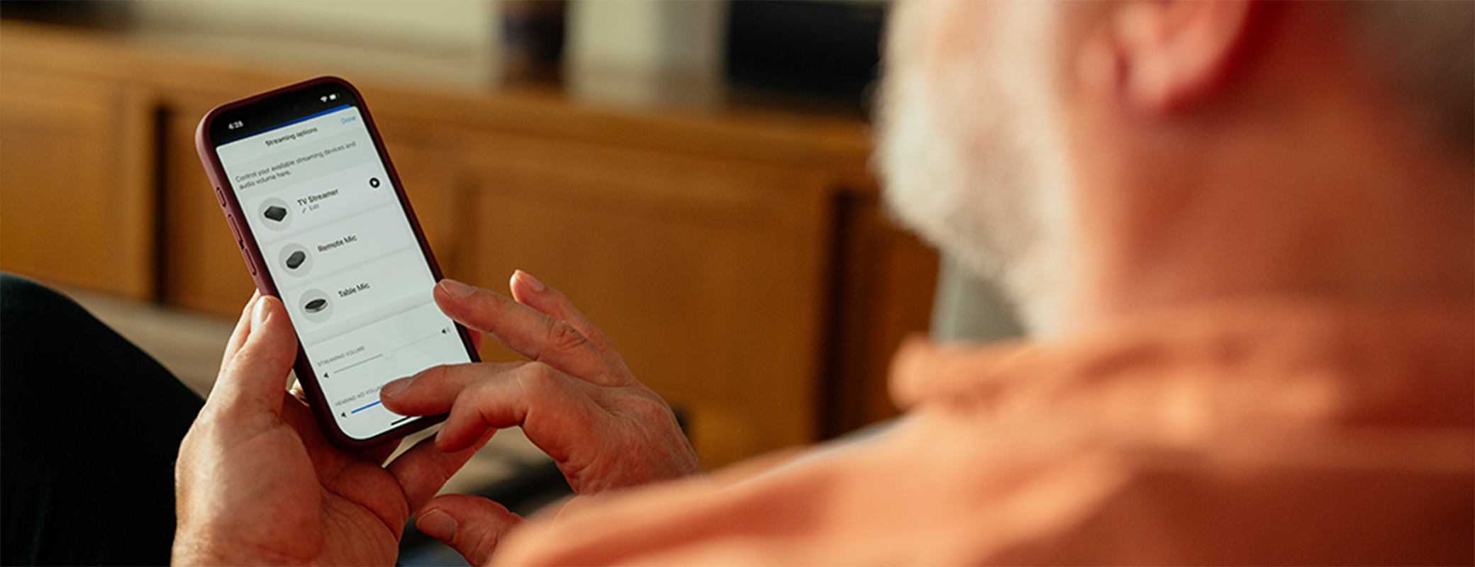 Image of man selecting an accessory to stream from his My Starkey app screen
